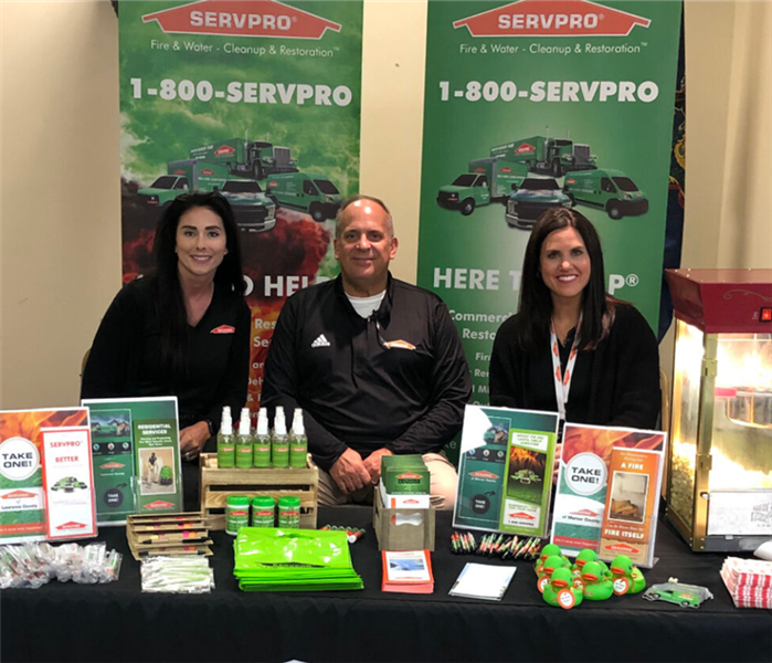 Servpro employees behind a table